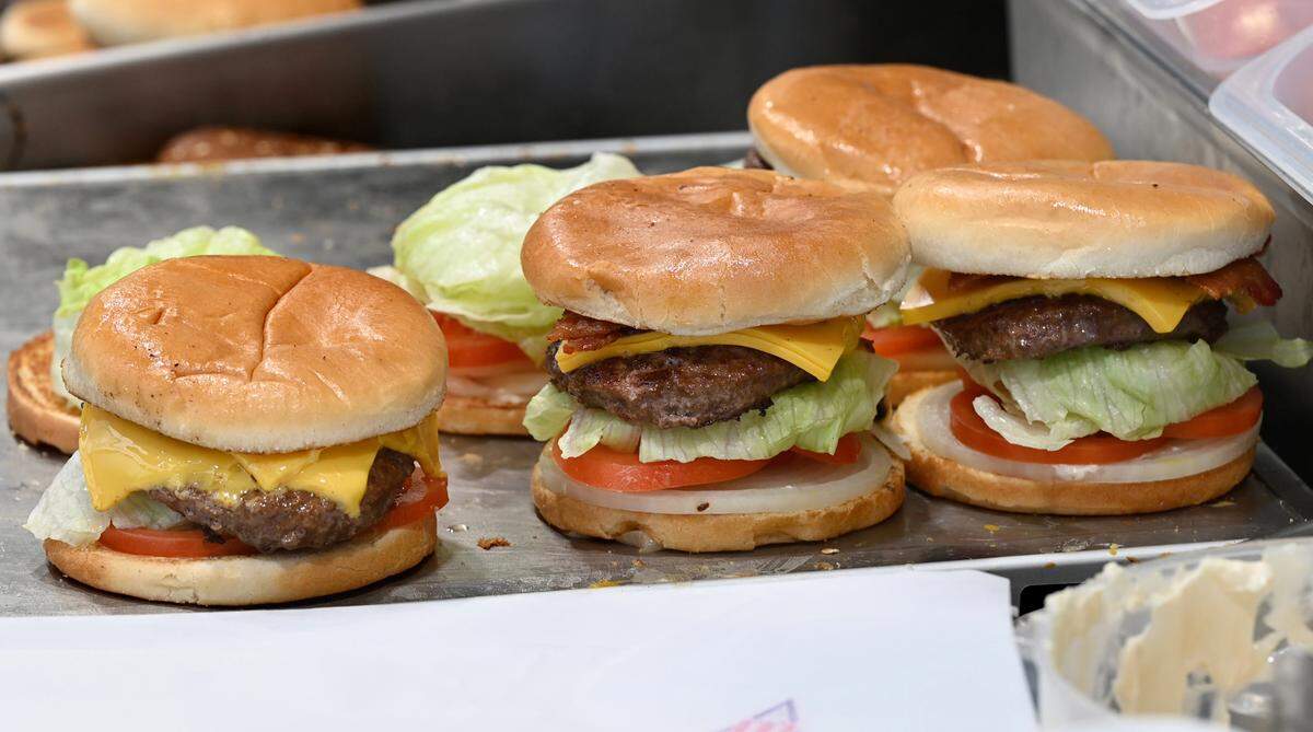 Burgers ready to be wrapped at Nation’s Giant Hamburgers on McHenry Avenue in Modesto, Calif., Wednesday, Nov.16, 2022.