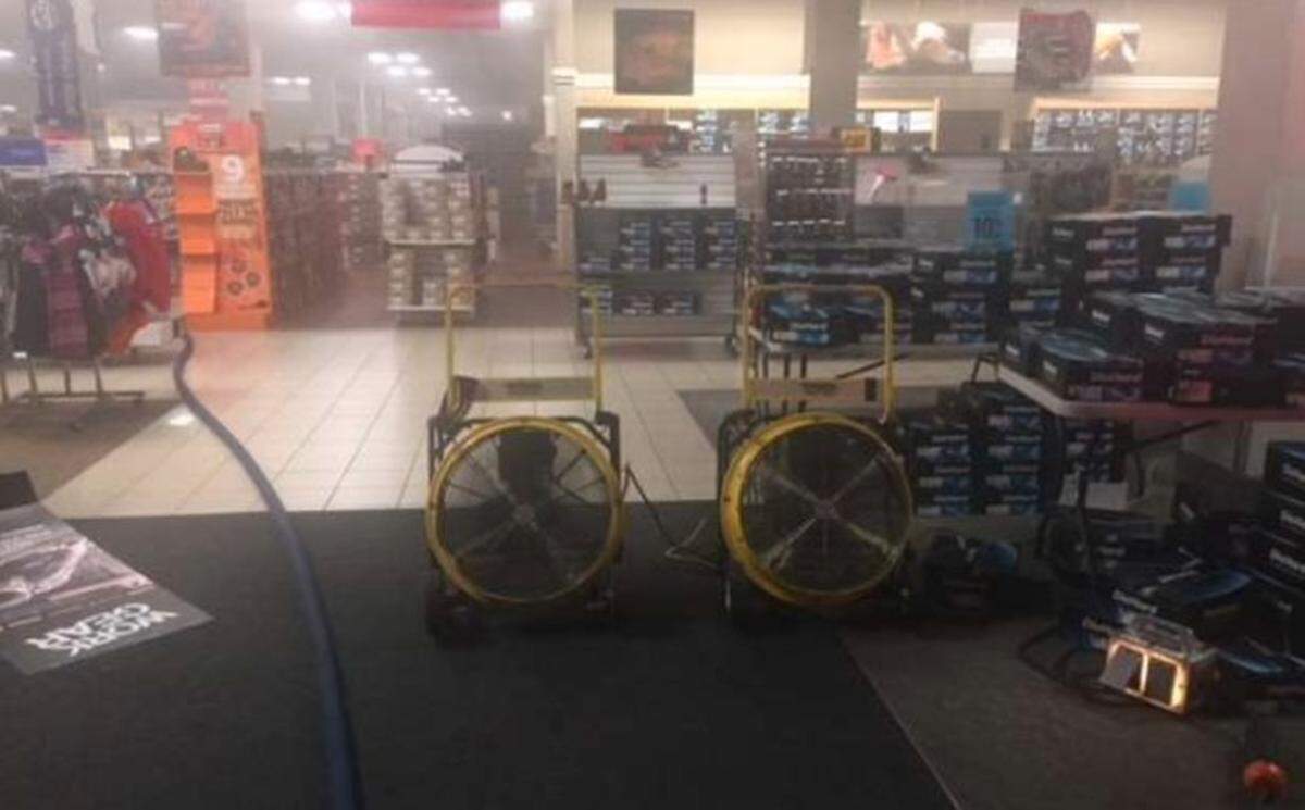 Firefighters placed fans to get the smoke out after a fire at the Sears store in Modesto on Monday, June 19, 2018.