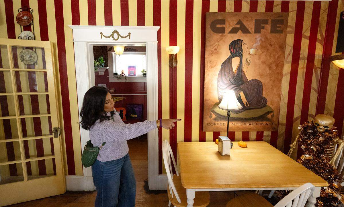Co-owner Ruhi Sheikh points out that over the coming months they plan to make changes to the interior design at Queen Bean Coffee & Social House in Modesto, Tuesday, Oct. 22, 2024.