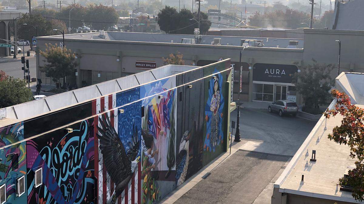 Smoke from the Camp Fire in Butte County hangs over downtown Modesto, Calif. on Monday afternoon November 12, 2018. The San Joaquin Valley Air Pollution Control District measured the air quality as “unhealthy” in Stanislaus County today.
