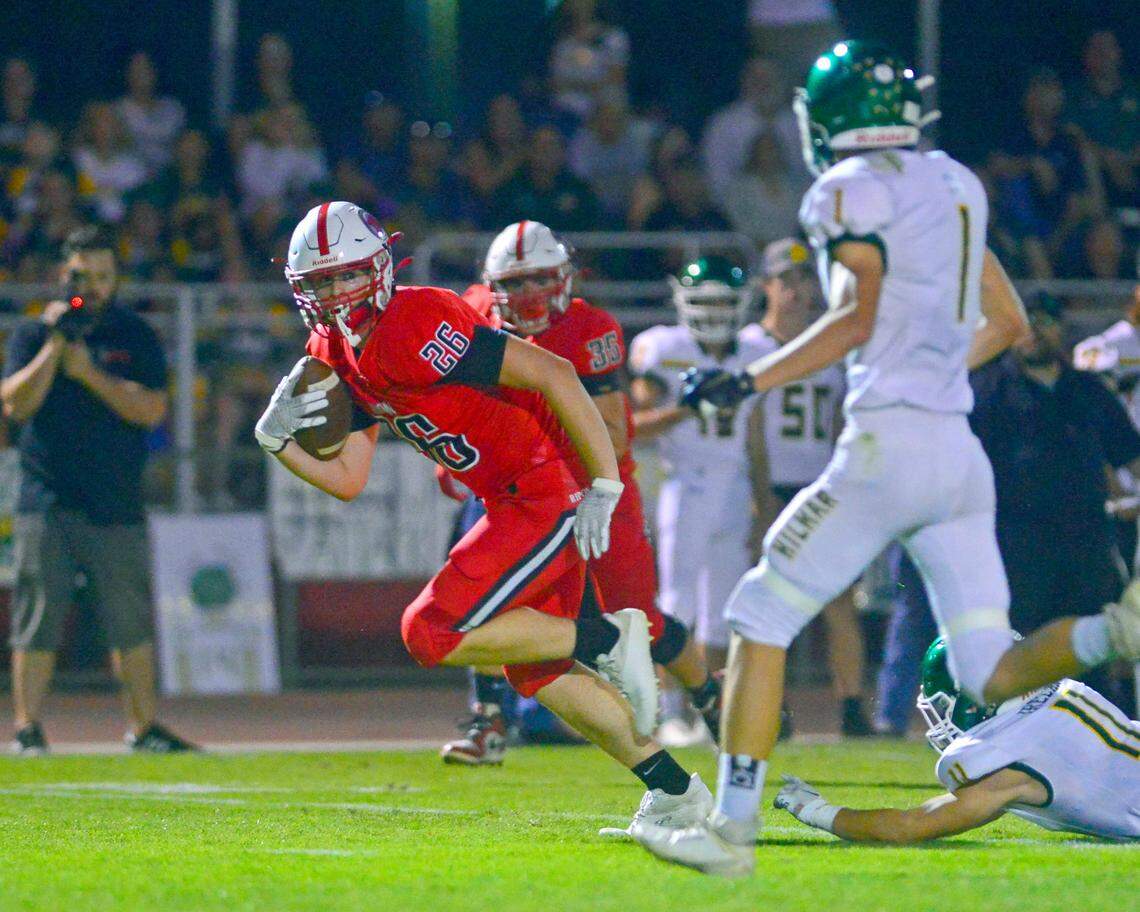 Ripon receiver Landon Thomas runs upfield after making a catch during a football game between Hilmar and Ripon High School at Ripon High School in Ripon CA on September 24, 2021