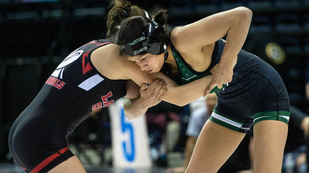 Lilly Avalos of Pitman, right, pinned Laguna Creek’s Isabelle Camarillo at 1:18 to win the 121-pound championship match in the Sac-Joaquin Section Masters wrestling championships at Stockton Arena in Stockton, Calif., Saturday, Feb. 18, 2023.