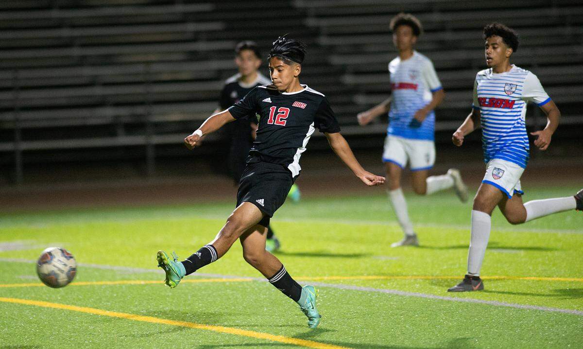 Modesto’s Alexis Ruiz takes a shot on goal during the Sac-Joaquin section playoff game at Downey High School in Modesto, Calif., on Thursday, Feb. 10, 2022. Modesto won 3-0.