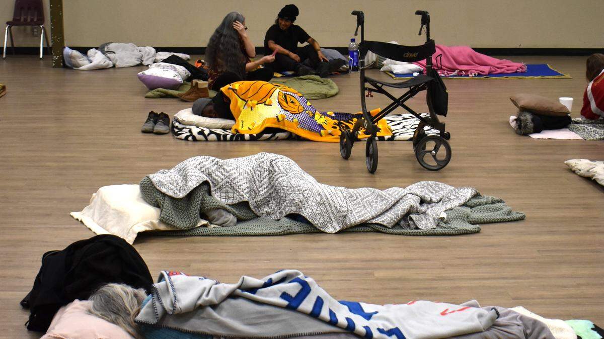 Women settle in for the night at the Modesto Gospel Mission on Yosemite Boulevard on Thursday, Nov. 9, 2023.