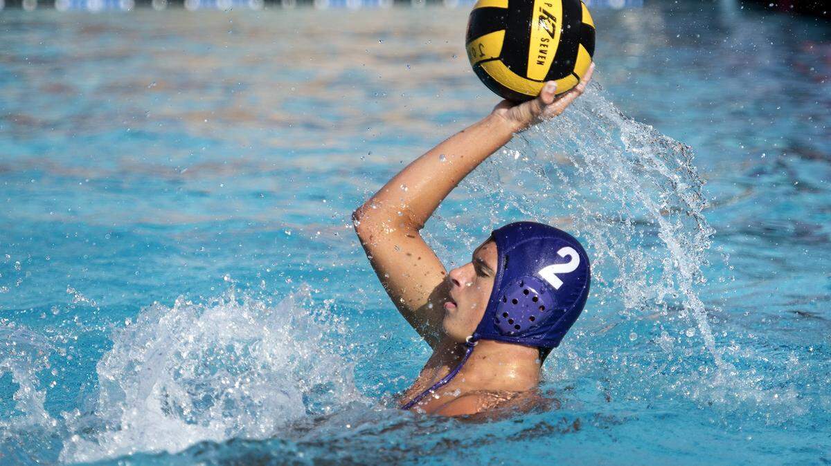 Johansen's shelby Johnson passes off the ball during the Modesto Metro Conference match with Enochs at Johansen High School in Modesto, Calif., on Tuesday, September 20, 2016. Enochs won the game 9-4.