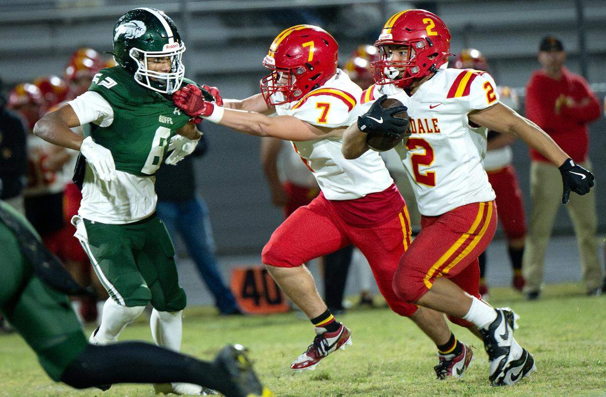 Oakdale’s Richard Flores (2) breaks out on a run during the Valley Oak League game with Manteca at Manteca High School in Manteca, Friday, Nov. 1, 2024.