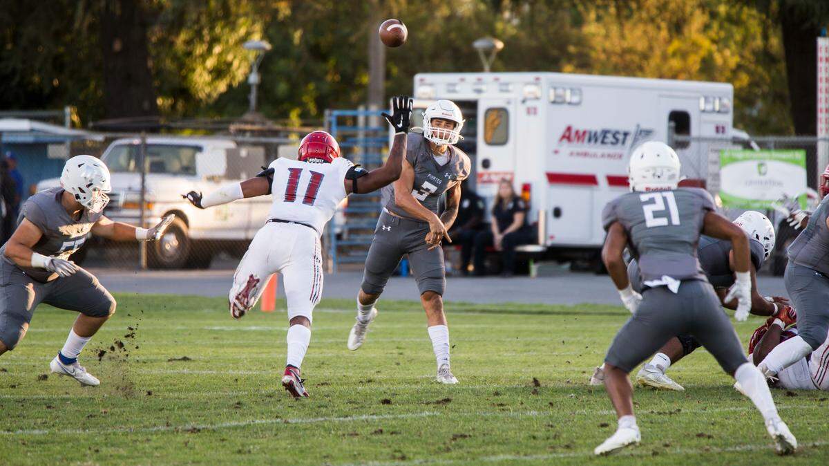 Modesto Junior College quarterback Gino Campiotti throws a pass to Jacob DeJesus during the Pirates’ loss to City College San Francisco on Saturday, Sept. 18, 2021, at MJC Stadium.
