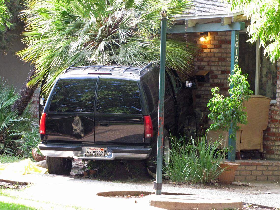 Erin Tracy/etracy@modbee.comThe SUV the suspect rammed into the home on Gemini Court.  Modesto police shot and killed a man suspected of stabbing a teenager and ramming an SUV into a home in Modesto early this morning, Aug. 14, 2012.