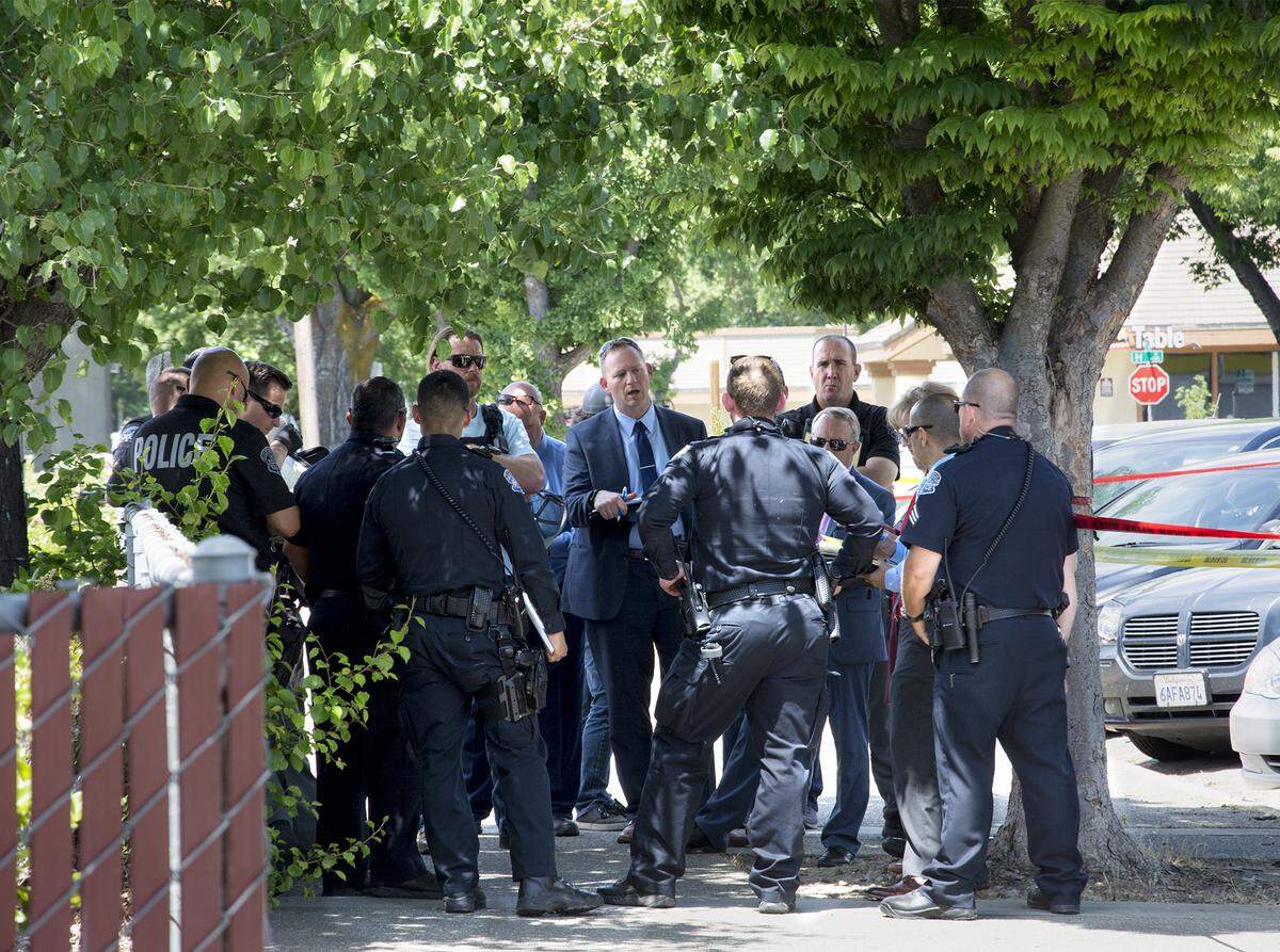 Modesto Police department investigators at the scene Monday May 13, 2019, where the body of Christina Hill was discovered near 18th and G streets in downtown Modesto, Calif.