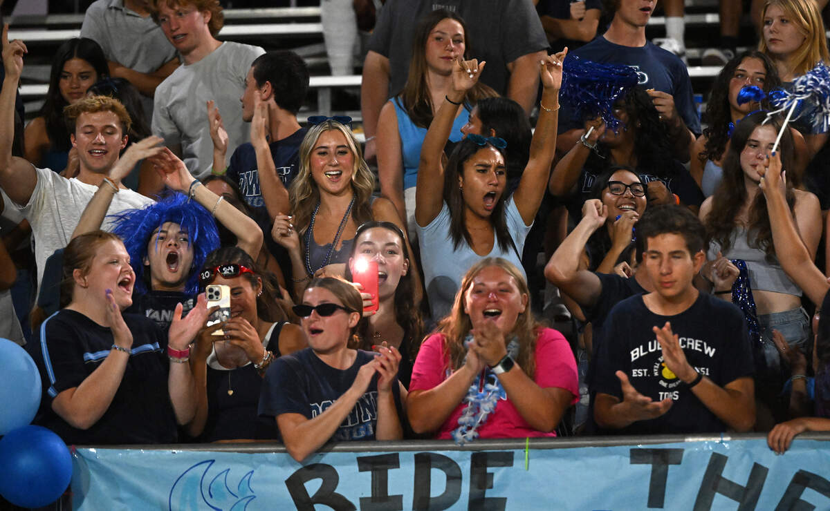 Downey students celebrate a touchdown during the game with Lincoln at Downey High School in Modesto, Calif., Friday, August 18, 2023.