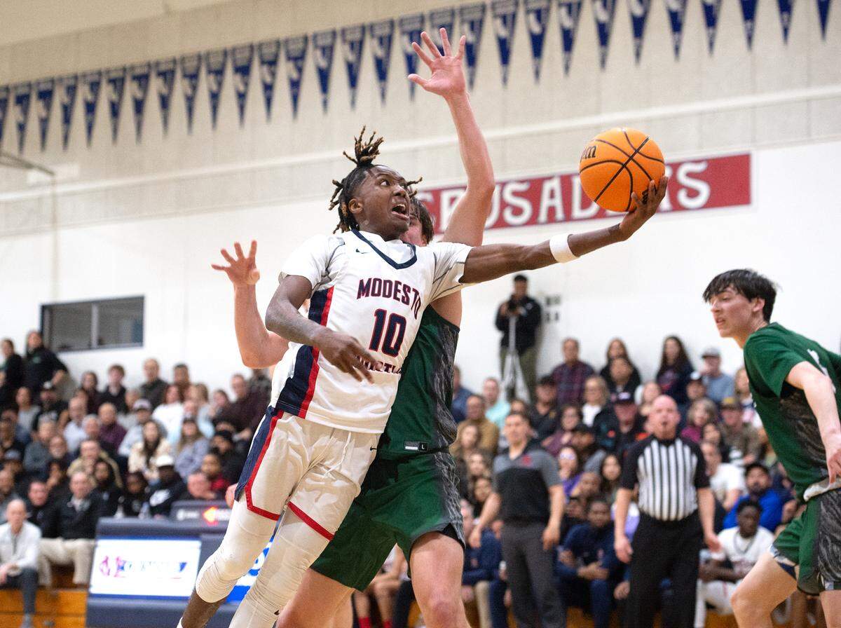 Modesto Christian’s BJ Davis scores on a layup during the NorCal Open Division semifinal playoff game with De La Salle in Salida, Calif., Saturday, March 4, 2023.