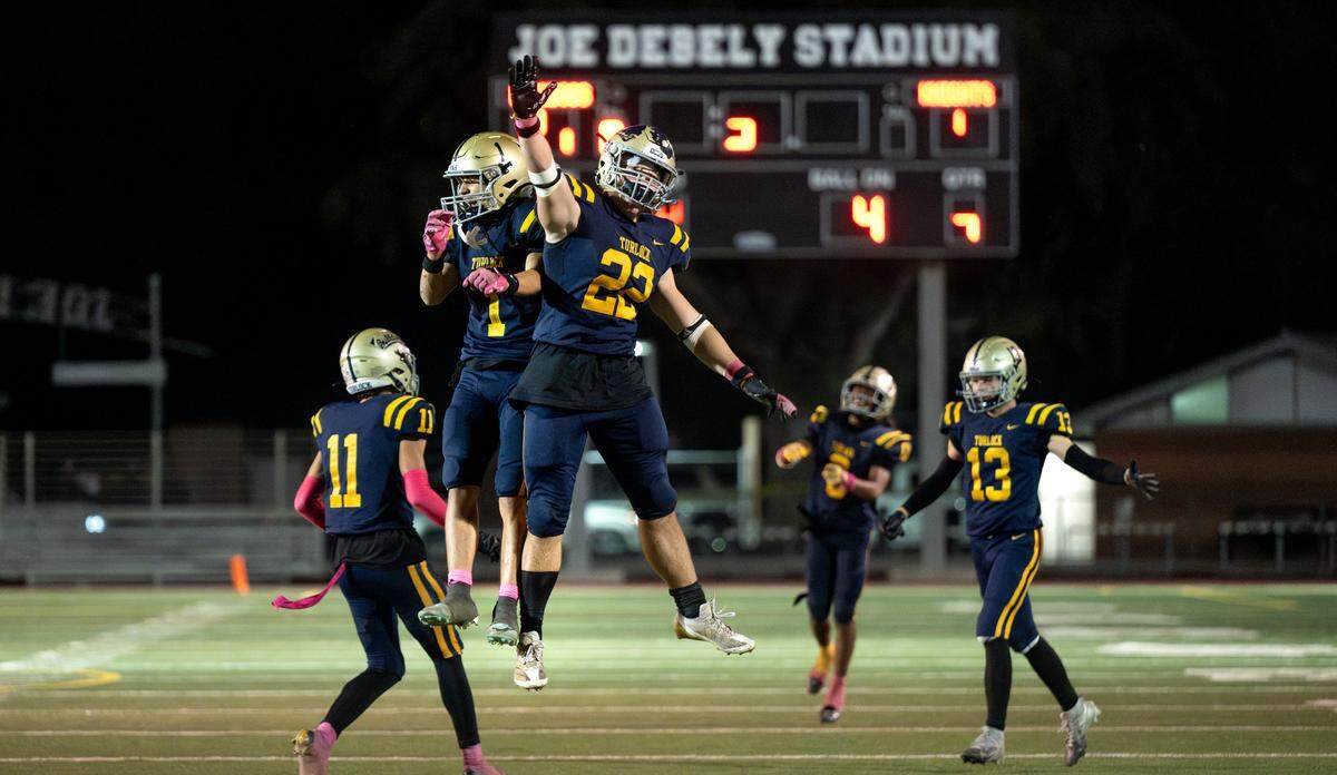 Turlock players celebrate a fourth quarter touchdown to ice the victory over Downey in the Central California Athletic League game at Turlock High School in Turlock, Friday, Oct. 18, 2024.