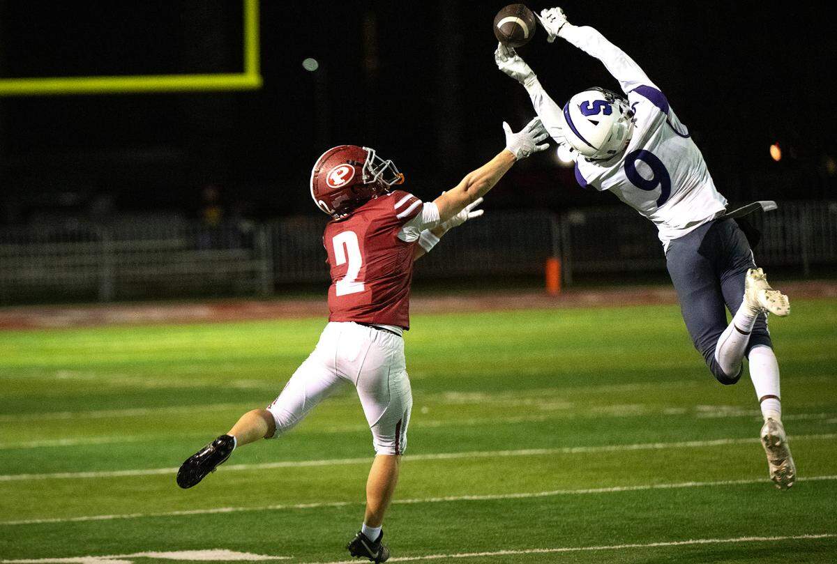 Patterson Damarie Taylor (9) breaks up aa pass to Patterson’s Noah Cozart during the Sac-Joaquin Section Division IV semifinal game with Sacramento at Patterson High School in Patterson, Friday, Nov. 22, 2024.