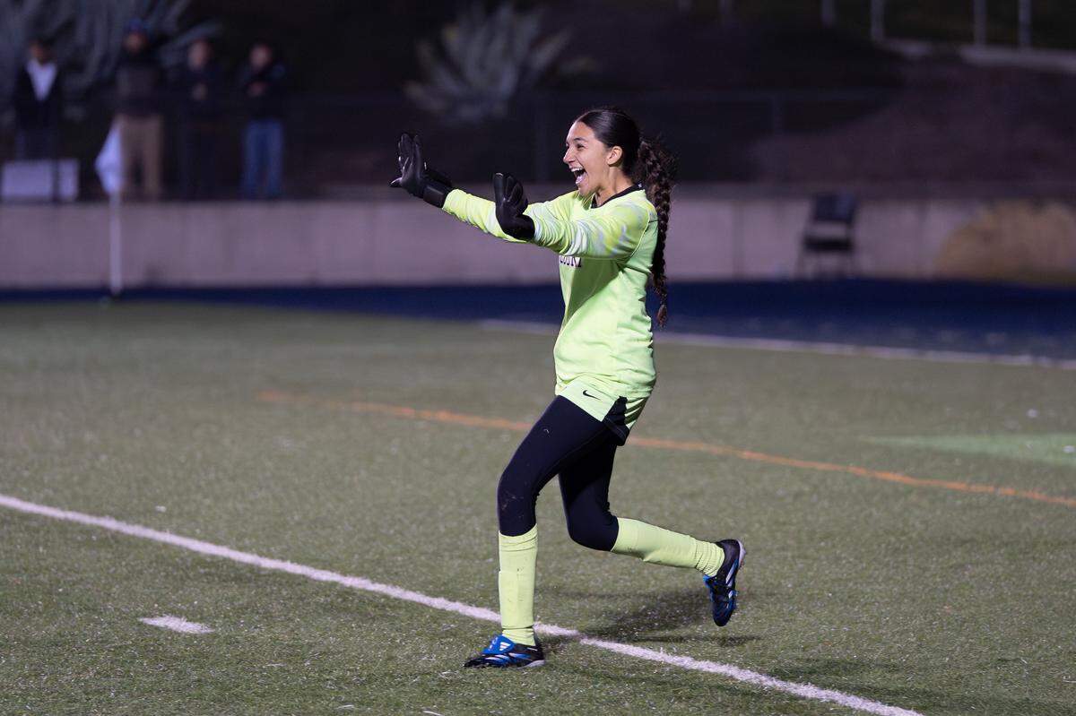Gregori goalkeeper Jocelyn Malagon runs to her teammates after making the game-winning save in a penalty shootout against Davis Senior High to win the CIF Sac-Joaquin Section Division I championship at Cosumnes River College on Saturday, Feb. 21, 2026.