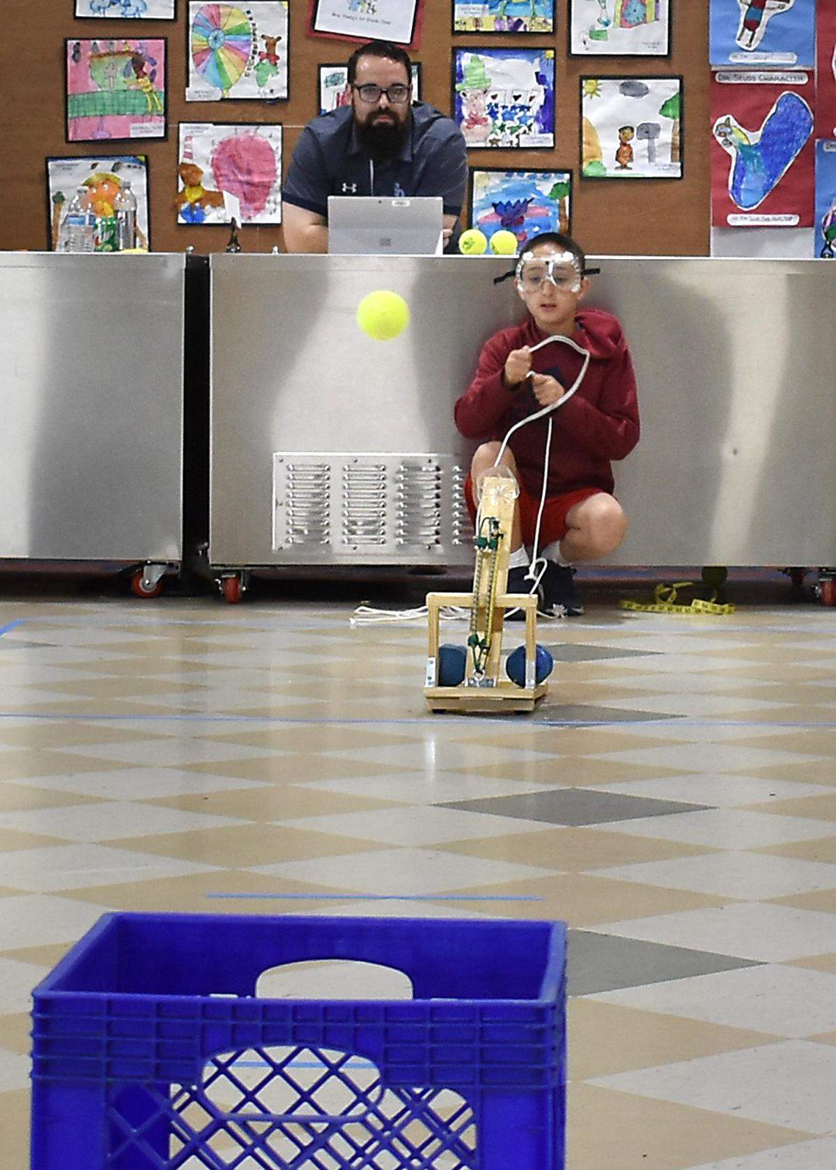 Walnut Elementary School’s gold team, Caleb Grossman and Alison Coughlin, launches a tennis ball from its catapult during the 22nd annual Stanislaus County Elementary Science Olympiad at Walnut Elementary School in Turlock on Saturday, March 30, 2019.