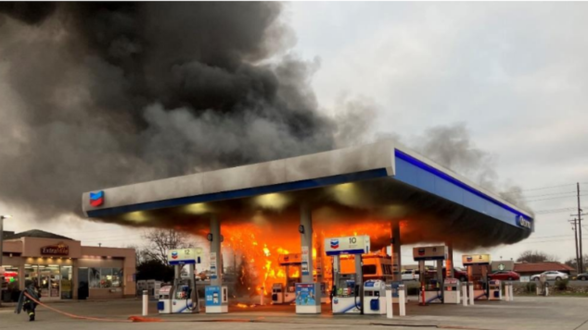 Firefighters from the Modesto Fire Department respond to a fully-involved vehicle fire at a Chevron gas station on the 1500 block of Herndon Road in south Modesto on Tuesday, Jan. 16, 2024.