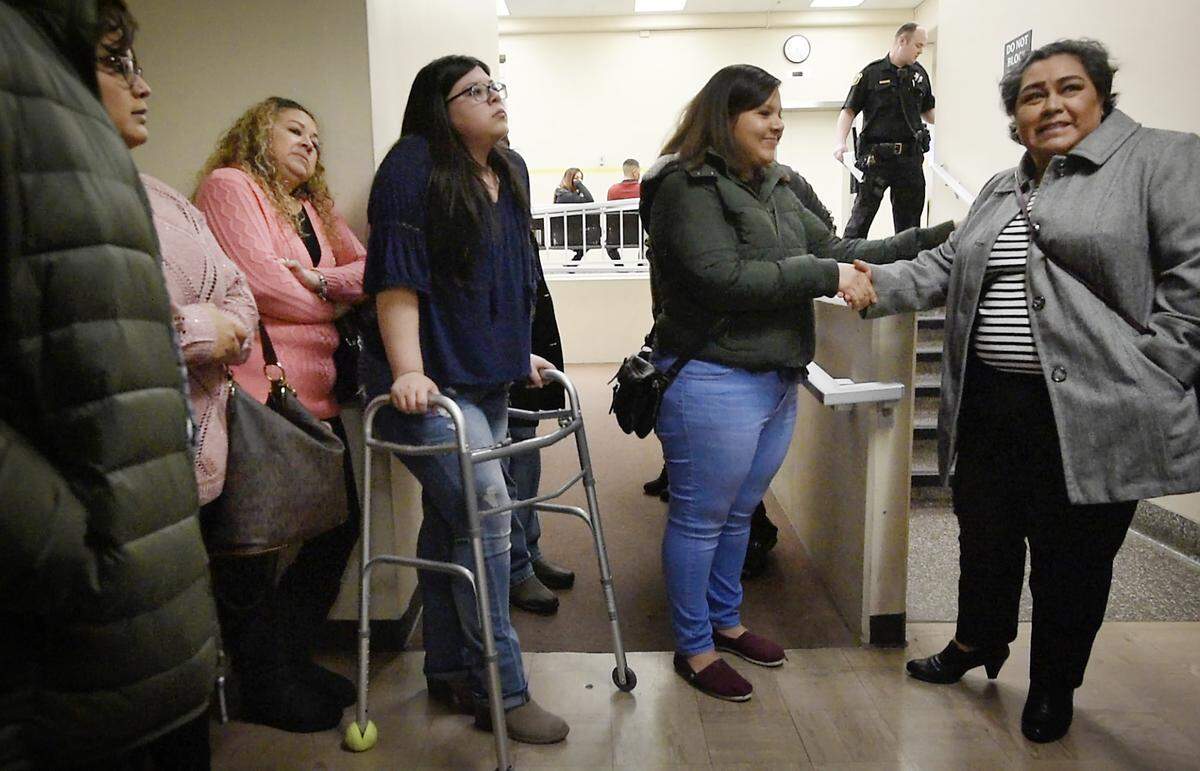 Family of Freida Pineda and Rebecca Murillo, with walker, attend the arraignment of Kevin Hernandez Solis at the Stanislaus Superior Court in Modesto, Calif., Wednesday, Jan. 16, 2019. Solis was arrested last month on suspicion of driving under the influence in a crash that killed a 14-year-old Pineda and seriously injuring Murillo and her sister in Turlock.