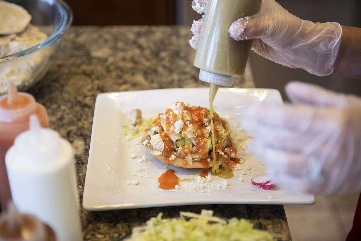 Carina Stringfellow, owner Super Sope, makes a chicken con todo sope at her home in Turlock, Calif., on Tuesday, Jan. 14, 2020.