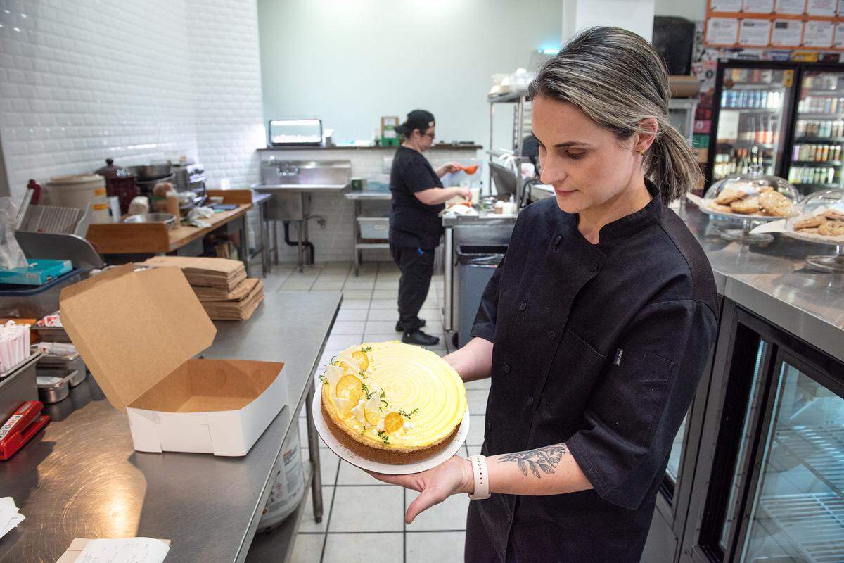 Ashley Olson holds a meyer lemon cheesecake at co-owner of Food Fix Butcher & Baker in Modesto, Calif., on Friday, Feb. 25, 2022. The owners Hank and Ashley Olson are taking over the former Barkin’ Dog restaurant space to build a new bakery.