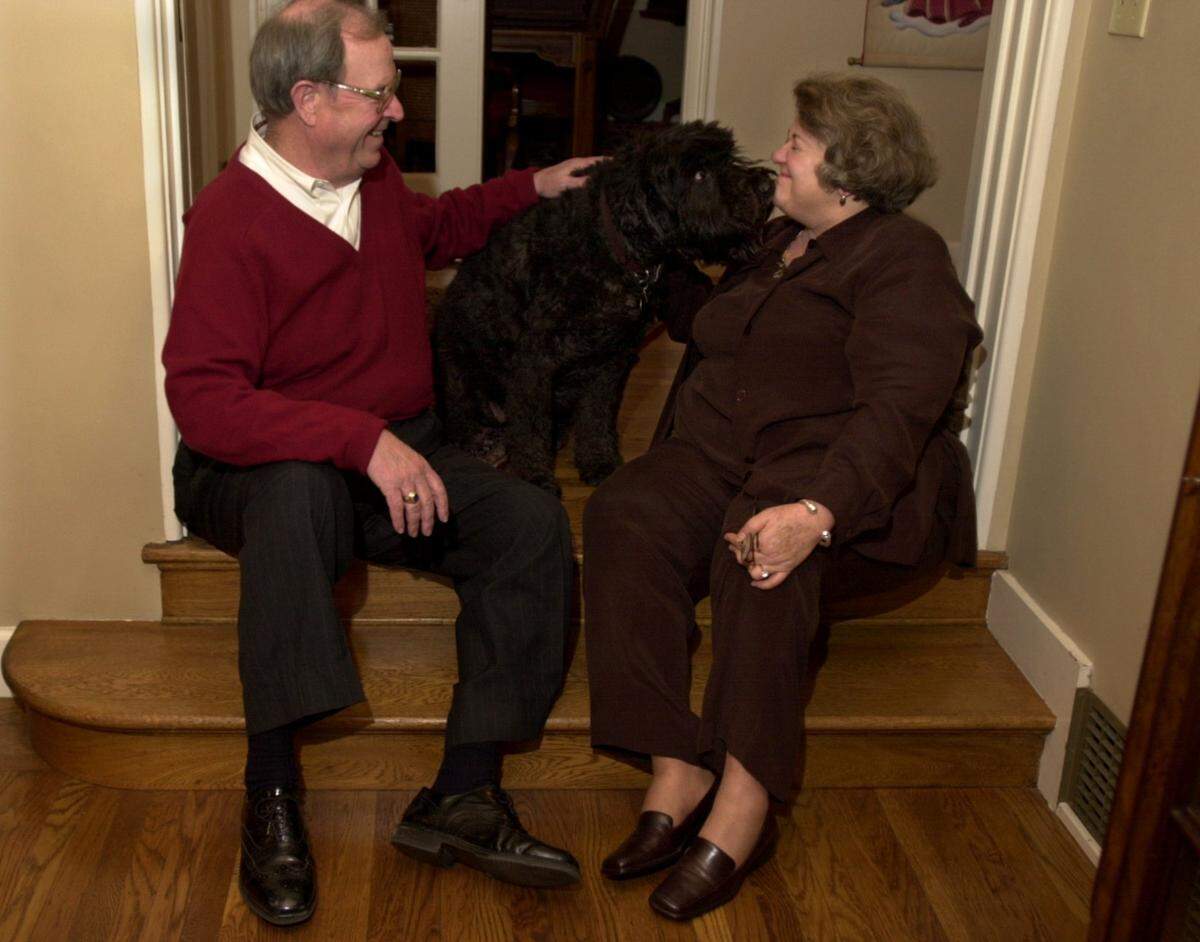 Carol Whiteside of Modesto, the Executive Director of The Great Valley Center, is pictured in her home on Monday evening(11-27-00) with her husband John who is a Superior Court Judge and their dog Babe. Her hobbies include throwing parties and entertaining.