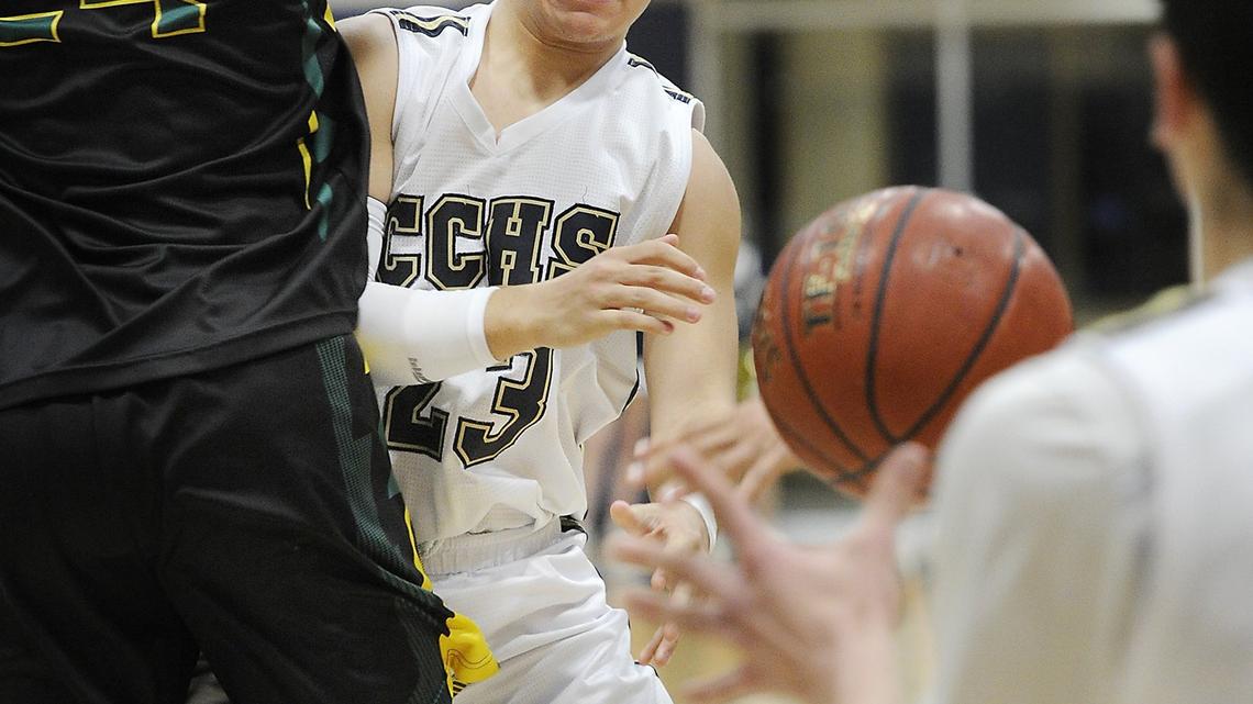 Central Catholic’s Dayton Magana passes off the ball to Nic Sani during first round of the CIF State Division III Northern California regional tournament game with Monterey at Central Catholic High School in Modesto, Calif., on Wednesday, March 7, 2018. Central Catholic won the game 55-51.