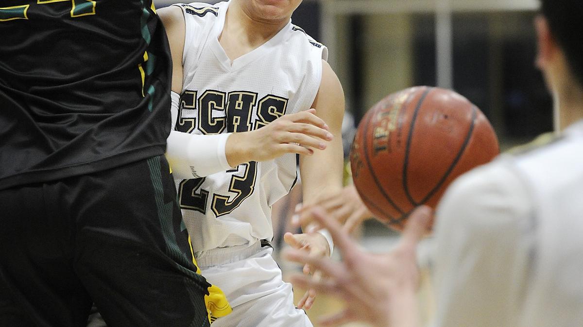 Central Catholic’s Dayton Magana passes off the ball to Nic Sani during first round of the CIF State Division III Northern California regional tournament game with Monterey at Central Catholic High School in Modesto, Calif., on Wednesday, March 7, 2018. Central Catholic won the game 55-51.