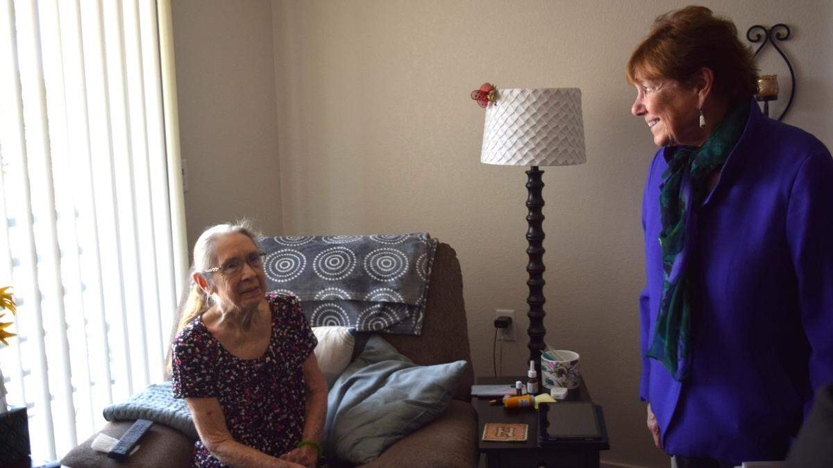 Marple Manor resident Mae LeRoy speaks with Ann Veneman, former U.S. secretary of agriculture and former UNICEF executive director, in her newly renovated room on April 23, 2025.