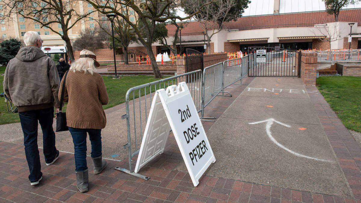 Residents over 65 years of age arrive at Modesto Centre Plaza for their second Pfizer vaccination in Modesto, Calif., on Friday, Feb. 19, 2021. A continued shortage of COVID vaccine went from bad to worse Friday as Stanislaus County postponed additional community vaccine clinics until further notice.
