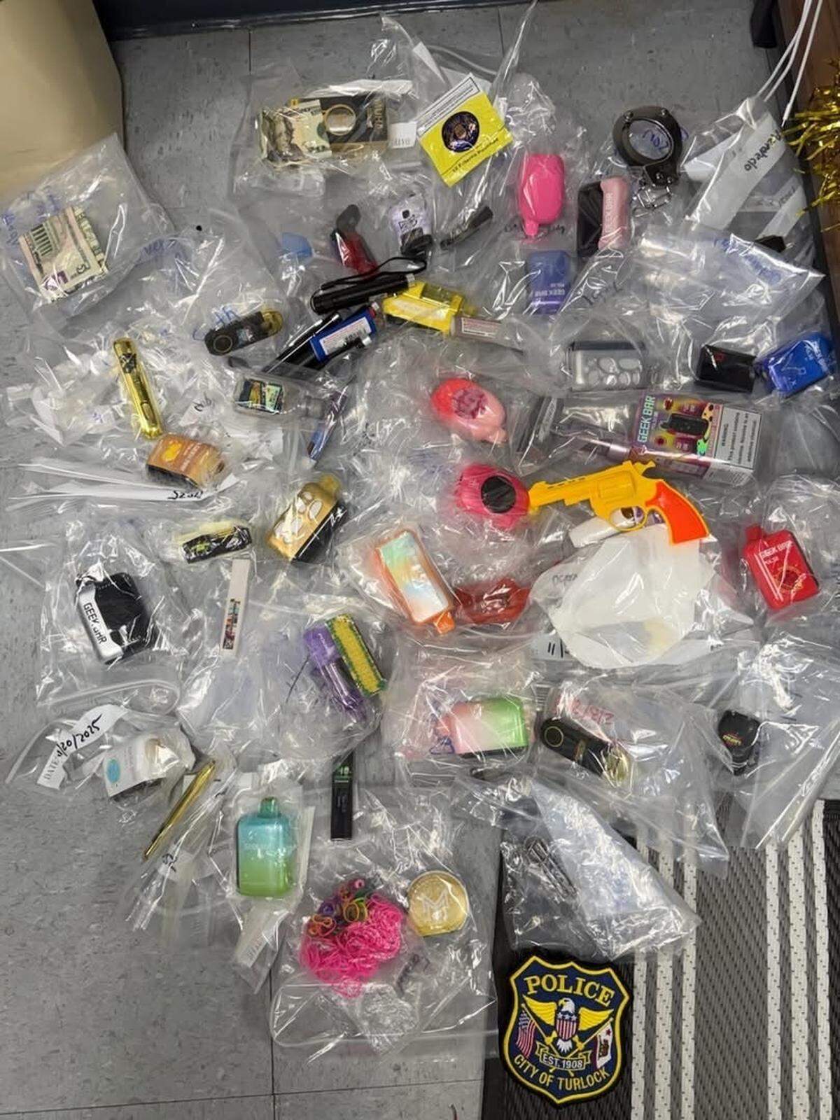 Items including vape devices, nicotine products and THC-related products confiscated during the 2025-26 school year at Turlock Junior High School are shown in a photo released by the Turlock Police Department.