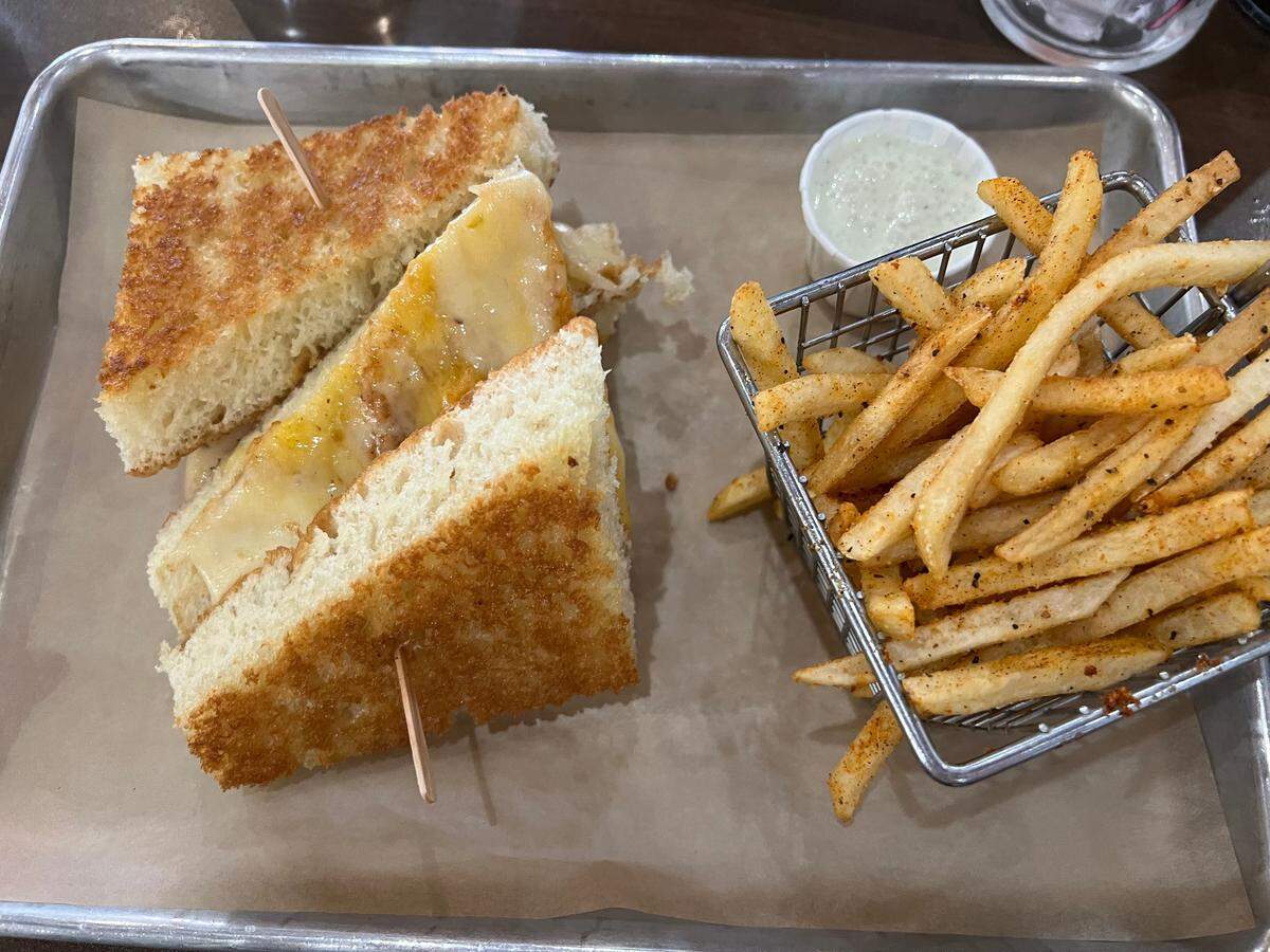 The Big Fat Grilled Cheese sandwich, which is made with scratch-made focaccia, cheddar, pepper jack and Havarti cheese, is priced at $16 at Modesto’s Food Fix Butcher and Baker.