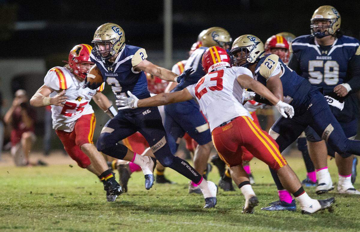Central Catholic’s Tyler Jacklich breaks through the Oakdale defense to score one of his two touchdowns during the Valley Oak League game in Modesto, Calif., Friday, Oct. 14, 2022.