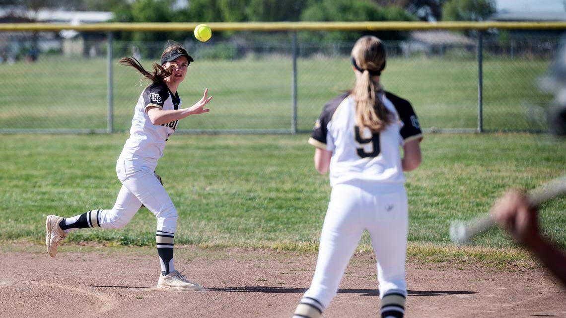 Enochs’ Jaidyn Pinnegar flips the ball to Kaylin McNeill for the out during the Central California Athletic League game with Modesto in Modesto, Calif., Tuesday, April 18, 2023.
