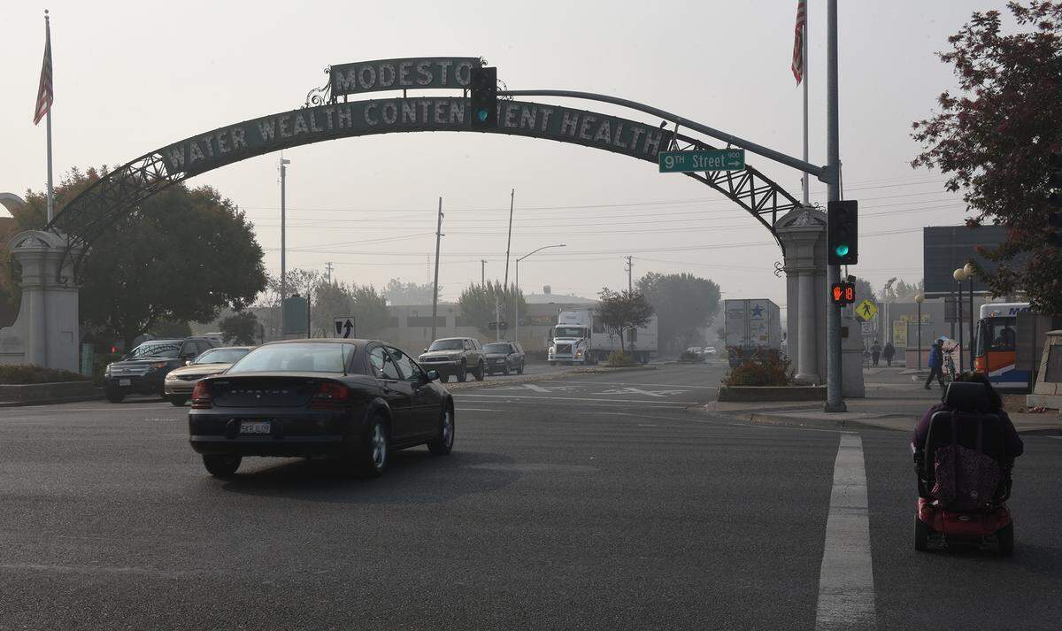 Smoke from the distant Camp Fire hangs over downtown Modesto, Calif., on Nov. 16, 2018. A lack of autumn rain had made the Butte County blaze especially fierce.