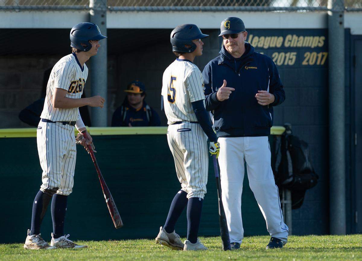Gregori coach James Davis, right, talks with Xander Martinez during the non-league game with Central Catholic at Gregori High School in Salida, Calif., Wednesday, March 15, 2023.