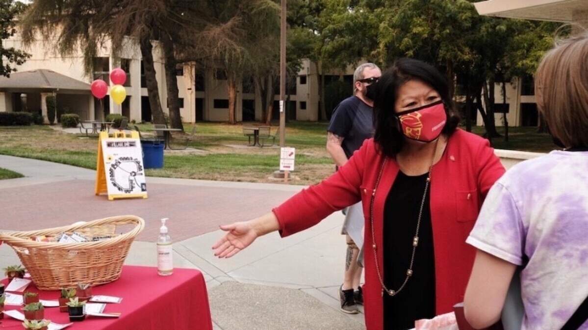 California State University, Stanislaus, President Ellen Junn offers students succulents as a housewarming gift on move-in day in August.