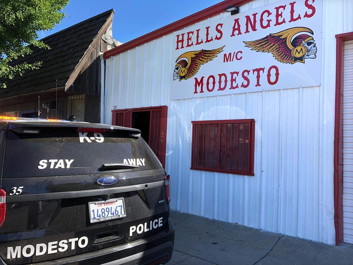 FBI and ATF agents and Modesto police officers served search warrants at the Seventh Street clubhouse of the Hells Angels motorcyle club in downtown Modesto, Calif. on Tuesday morning, June 25, 2019. Taken from the building were several bags of property and three motorcycles, which were loaded onto flatbed tow trucks.