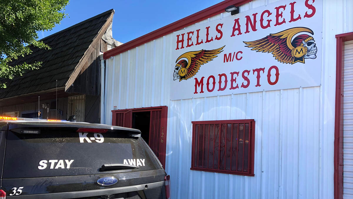 FBI and ATF agents and Modesto police officers served search warrants at the Seventh Street clubhouse of the Hells Angels motorcycle club in downtown Modesto, Calif. on Tuesday morning, June 25, 2019. Taken from the building were several bags of property and three motorcycles, which were loaded onto flatbed tow trucks.
