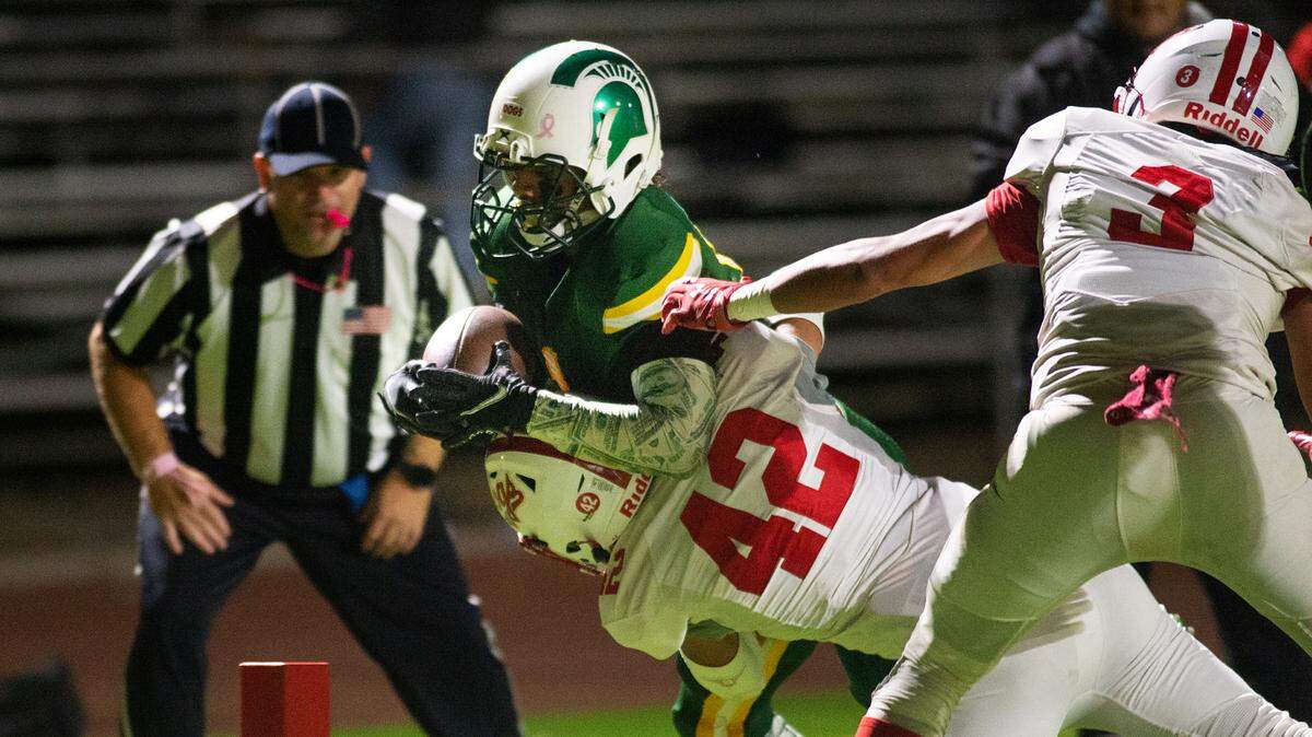 Ceres’s Austin Munguia stops Davis’ Isaac Martinez from scoring on a run during the Western Athletic Conference game at Downey High School in Modesto, Calif., on Thursday, Oct. 28, 2021.