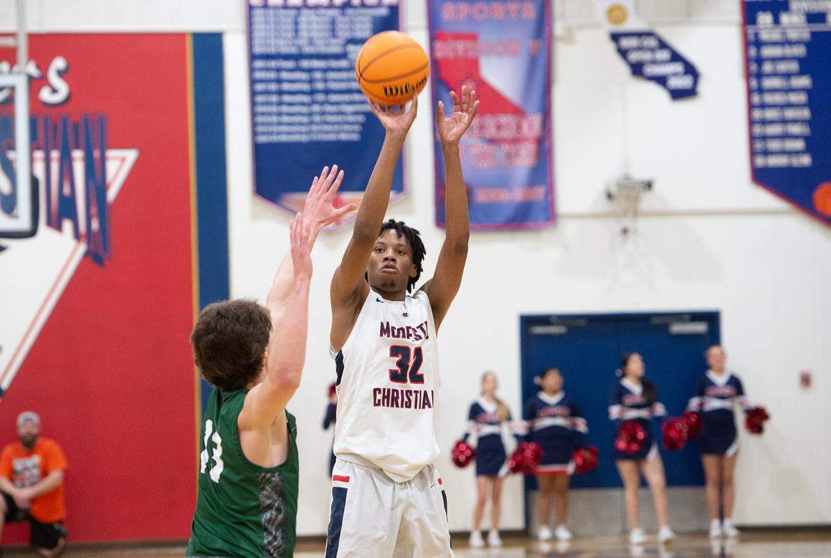 Modesto Christian’s Kodey Weary shoots a three point shot during the NorCal Open Division semifinal playoff game with De La Salle in Salida, Calif., Saturday, March 4, 2023. Modesto Christian won the game 57-56.