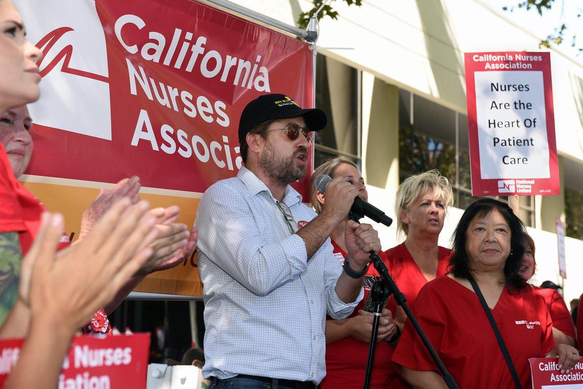 Tim Robertson, the executive director of the North Valley Labor Federation speaks at a rally on Friday afternoon September 20, 2019 during a one day strike outside Doctors Medical Center in Modesto, Calif. Nurses represented by the California Nurses Association have been in contract negotiations with Tenet for a year.