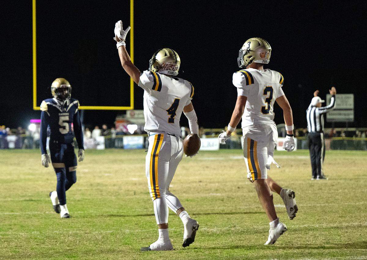 Turlock’s Joseph Delte (4) celebrates after scoring a touchdown on a run during the Sac-Joaquin Section Division I playoff game with Central Catholic at Central Catholic High School in Modesto, Friday, Nov. 15, 2024.