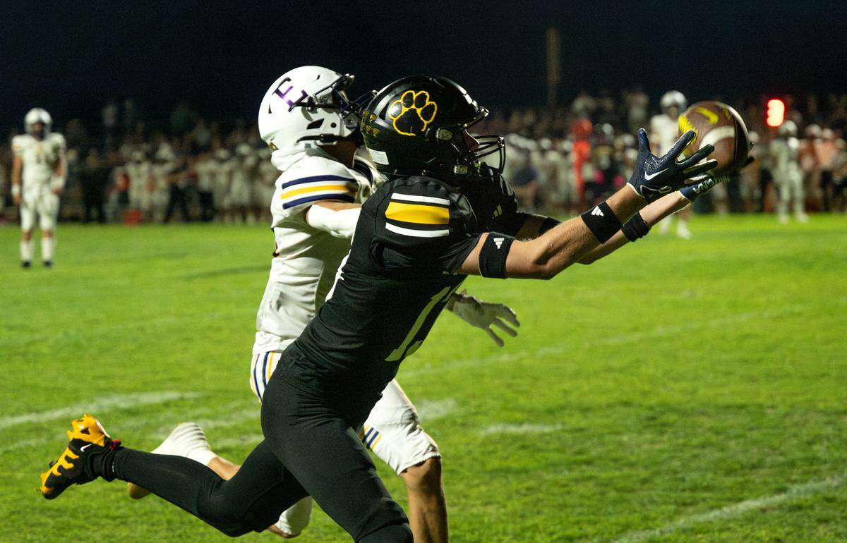 Hughson’s Bryce McDaniel makes a touchdown catch during the Trans Valley League game with Escalon in Hughson, Calif., Friday, Oct. 4, 2024.