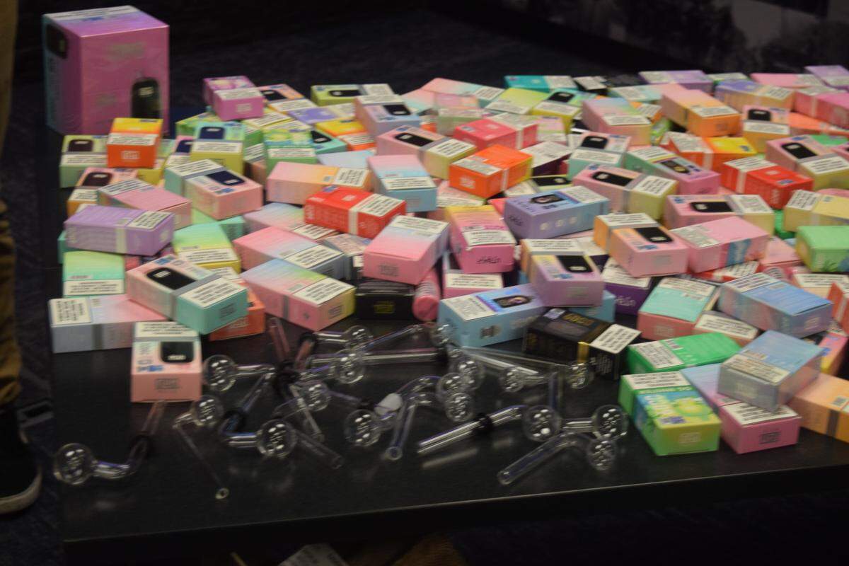 A table displaying flavored tobacco products, flavored vapes and meth pipes displayed during a Modesto Police Department press conference at their police station downtown on Oct. 18, 2024.
