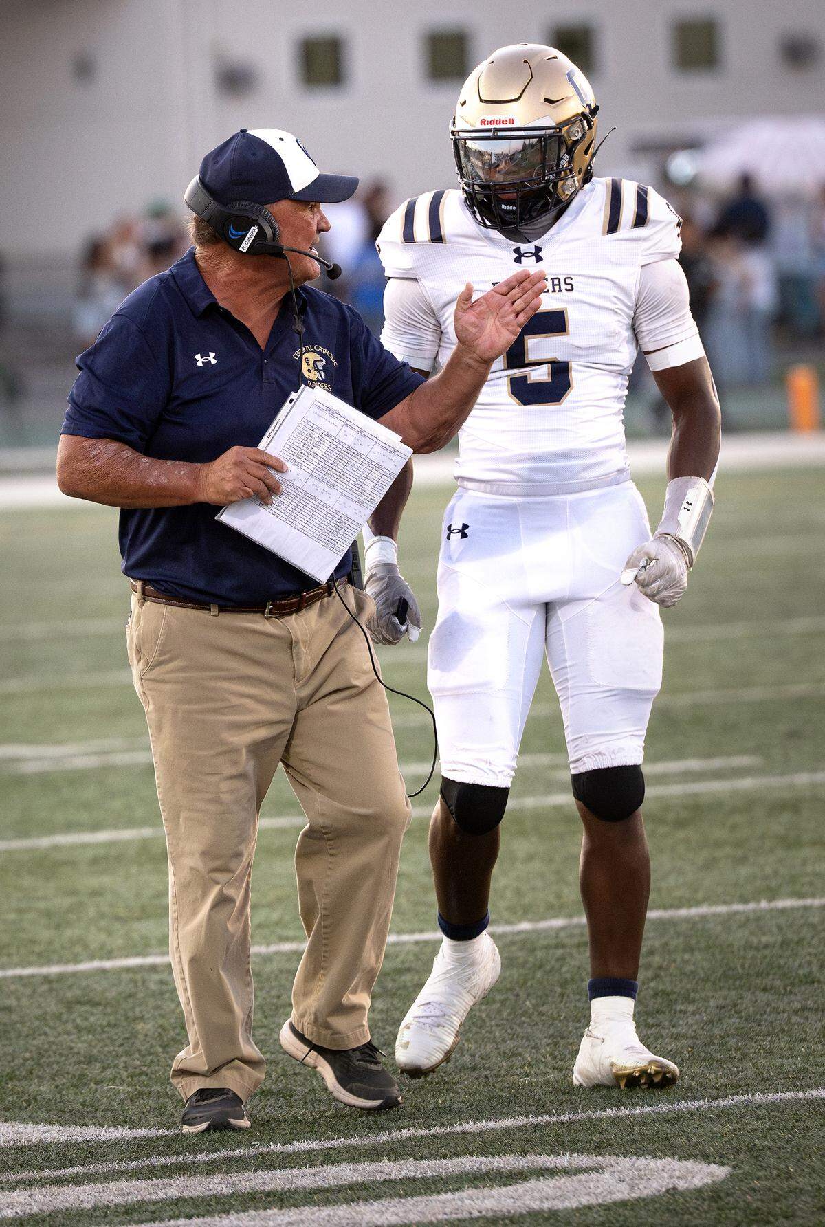Central Catholic head coach Roger Canepa talks with Carter Meeks during the non-league game with St. Mary’s at St. Mary’s High School in Stockton, Friday, Aug. 29, 2025.