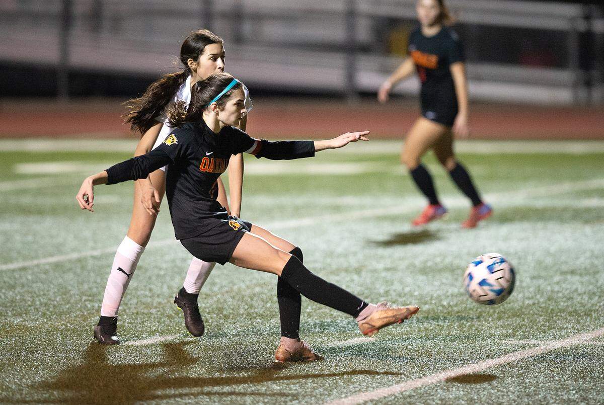 Oakdale’s Kyndra Obermeyer takes a shot on goal during the Valley Oak League game with Kimball in Oakdale, Calif., Friday, Jan. 20, 2023.