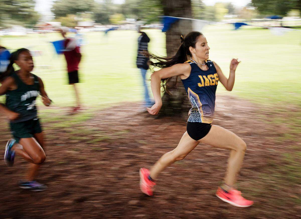 Gregori runner Eva Rodriguez, right, sprints to the finish line during the CCAL meet at Donnelly Park in Turlock, Calif., on Wednesday, Oct. 3, 2018. Rodriguez place fourth in the varsity race with a time of 19:05 and Pitman’s Camila Stephens, left, placed 5th with a time of 19:05.81.