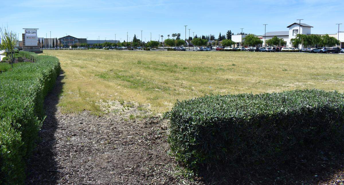 This undeveloped portion of The Marketplace in north Modesto is viewed from Oakdale Road and Sylvan Avenue, looking toward the Save Mart that anchors the shopping center, on Wednesday, April 10, 2024.