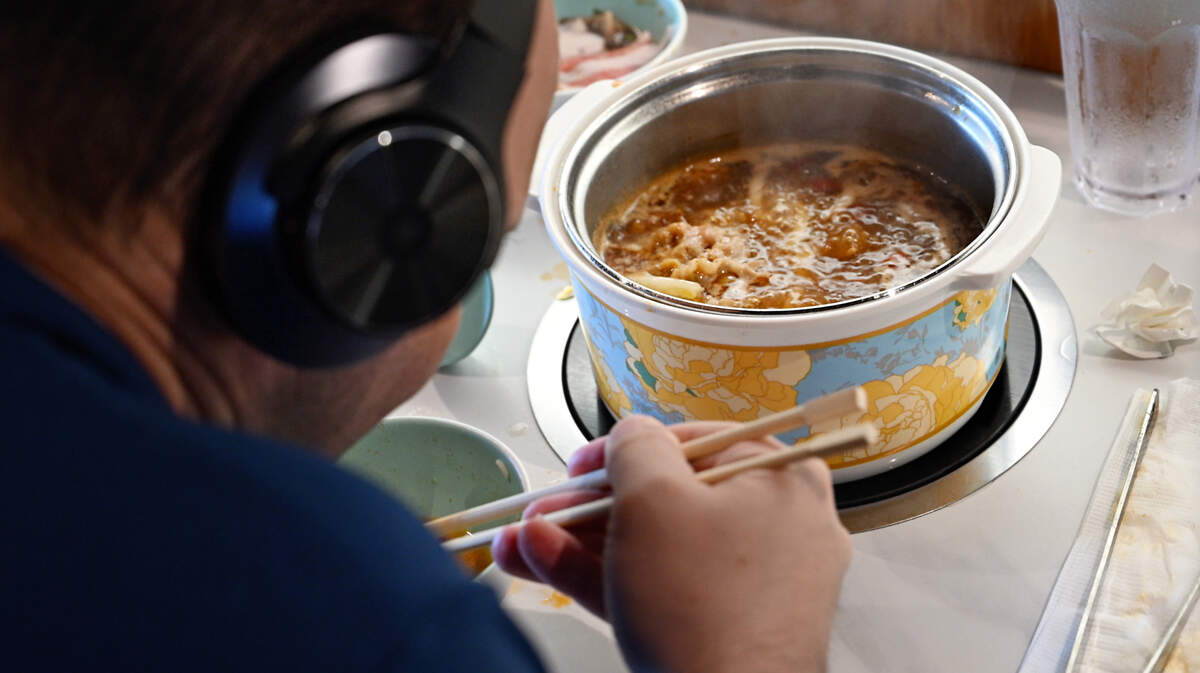Justin Duguay eats lunch at Hawai’i Pot Shabu Shabu House in Modesto, Calif., Tuesday, May 14, 2024.