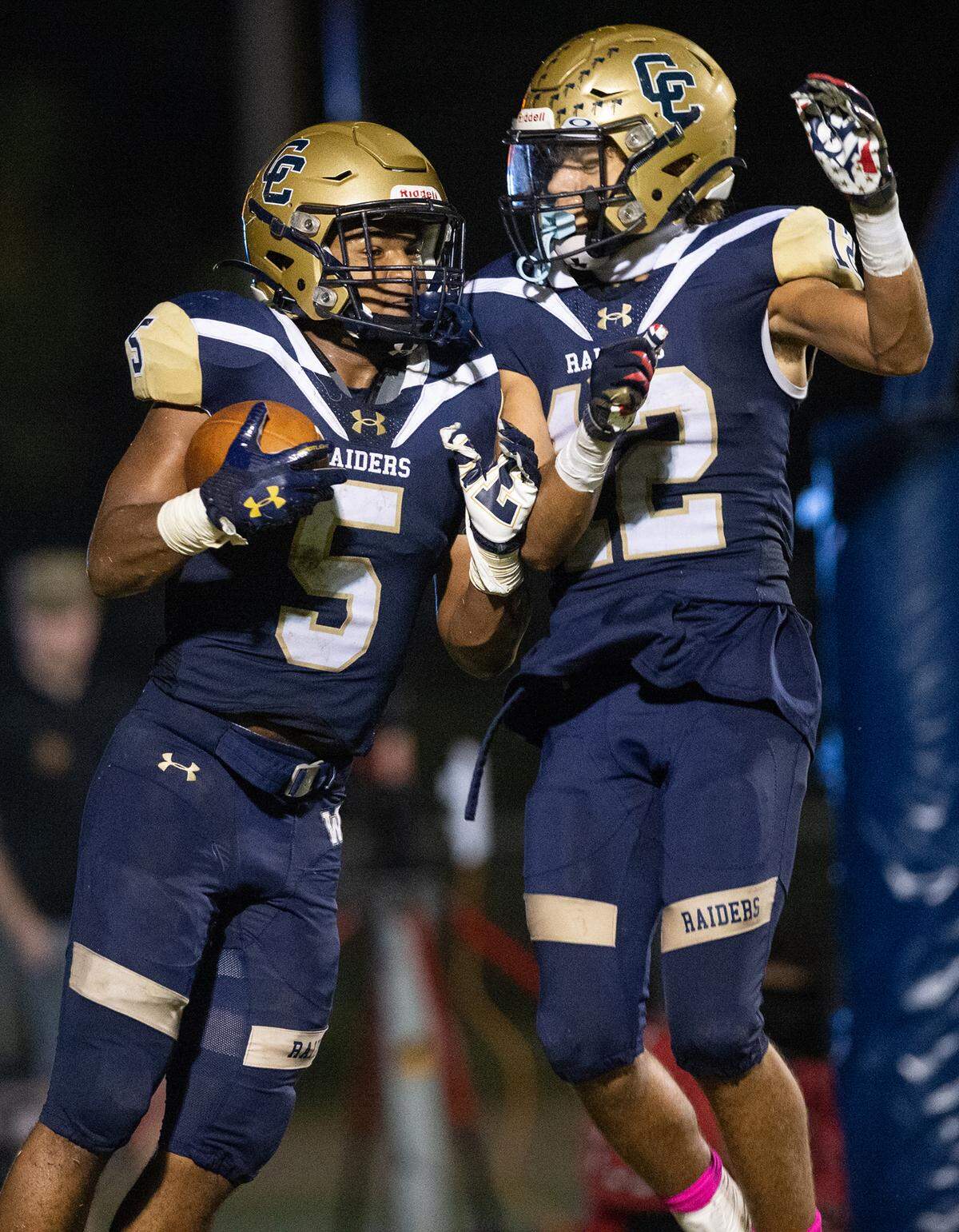 Central Catholic’s Jaelen Nichols (5) and Brooklyn Cheek (12) celebrate a touchdown during the Valley Oak League game with Oakdale in Modesto, Calif., Friday, Oct. 14, 2022.