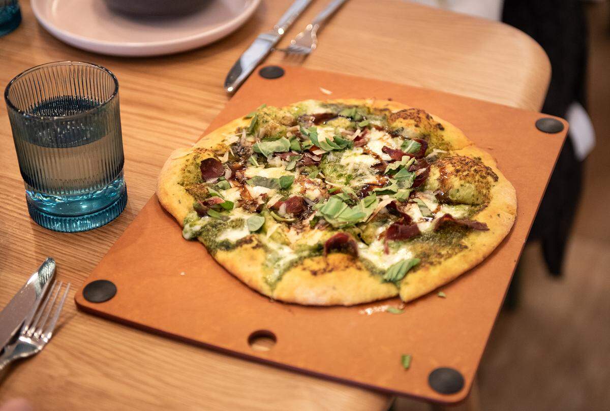Flat bread with pesto, mozzarella, prosciutto, balsamic drizzle and microgreens at Relish eatery on Main Street in Escalon, Calif., Tuesday, March 21, 2023.